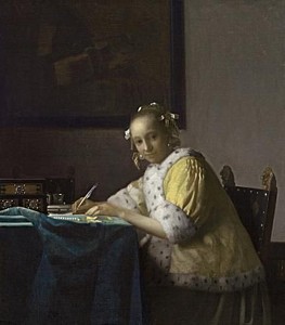 Afbeelding van onze reproductie van Schrijvende vrouw in het geel by Johannes Vermeer op canvas, klein
